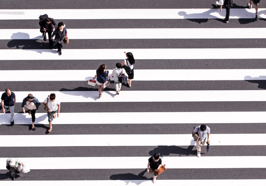 People walking across a street.